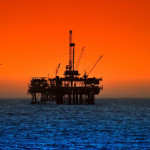 sunset on oil rig platform