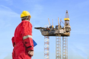 Worker and Oil Rig